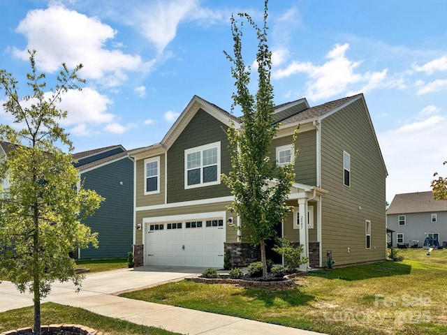2807 Oldfield Dr, Monroe, NC 28110 - craftsman-style home with concrete driveway, an attached garage, a front lawn, and stone siding