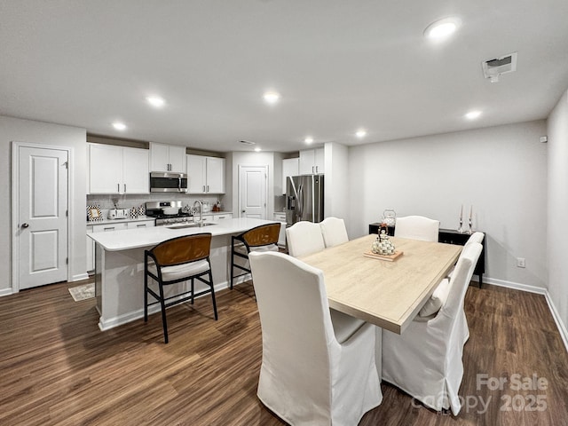 2807 Oldfield Dr, Monroe, NC 28110 - dining space with dark wood-style floors and recessed lighting