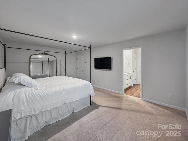 2807 Oldfield Dr, Monroe, NC 28110 - bedroom featuring light colored carpet and connected bathroom