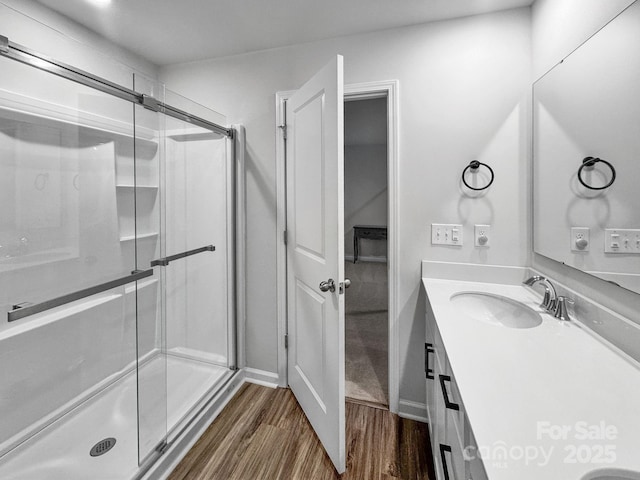 2807 Oldfield Dr, Monroe, NC 28110 - bathroom featuring wood finished floors, vanity, and a shower stall