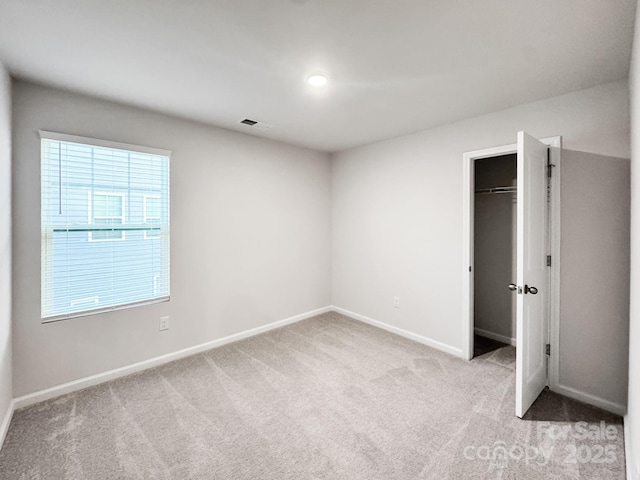 2807 Oldfield Dr, Monroe, NC 28110 - unfurnished bedroom featuring light colored carpet and a spacious closet