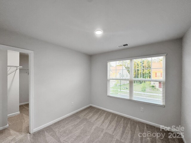 2807 Oldfield Dr, Monroe, NC 28110 - unfurnished bedroom featuring a spacious closet and carpet