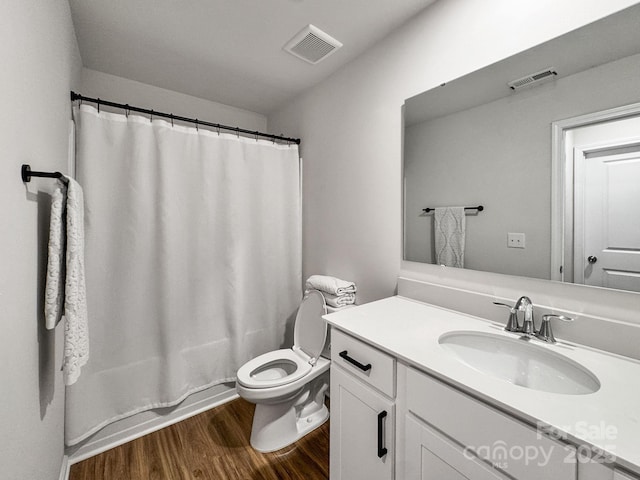 2807 Oldfield Dr, Monroe, NC 28110 - full bathroom featuring wood finished floors, vanity, and shower / bath combo