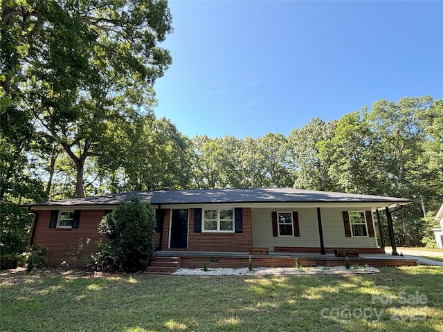 5335 NC-152 Hwy W, China Grove, NC 28023 - ranch-style house with a front yard, brick siding, and a porch