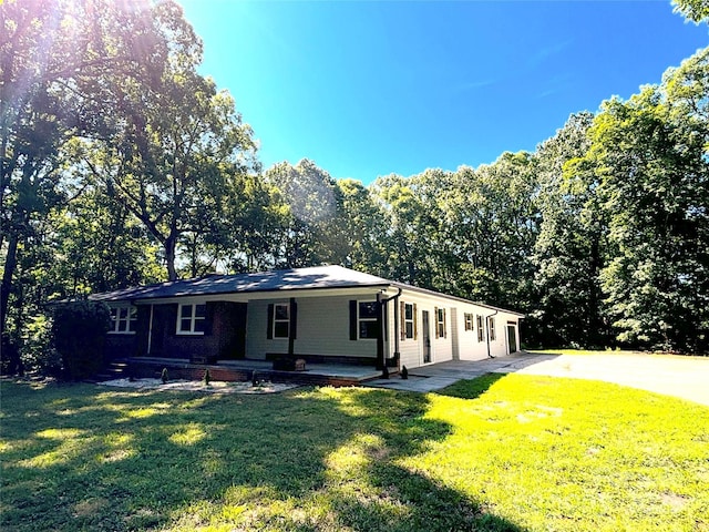 5335 NC-152 Hwy W, China Grove, NC 28023 - ranch-style house with a front yard, driveway, and a porch