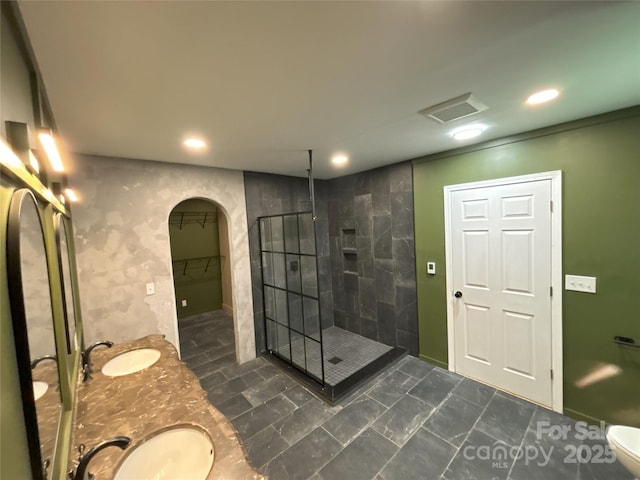 5335 NC-152 Hwy W, China Grove, NC 28023 - bathroom with a stall shower, double vanity, recessed lighting, and a walk in closet
