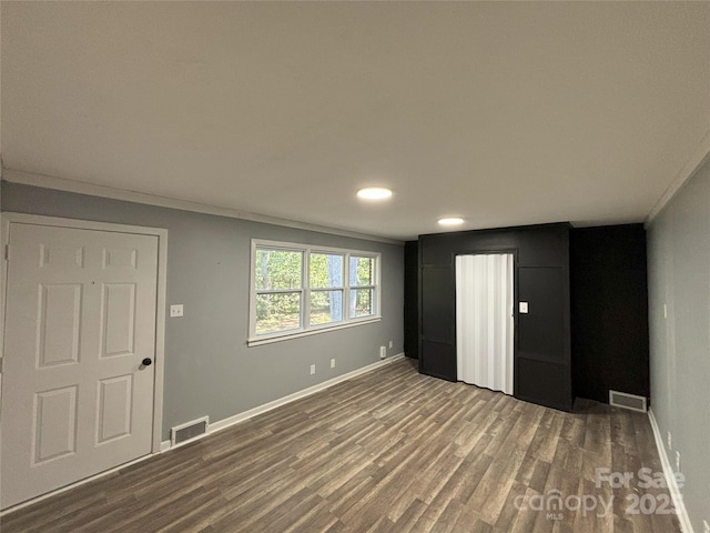 5335 NC-152 Hwy W, China Grove, NC 28023 - unfurnished bedroom with wood finished floors, recessed lighting, and crown molding
