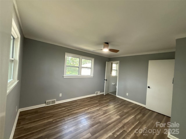 5335 NC-152 Hwy W, China Grove, NC 28023 - unfurnished bedroom featuring ornamental molding, dark wood-type flooring, and a ceiling fan