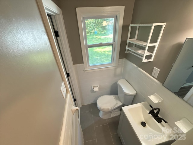 5335 NC-152 Hwy W, China Grove, NC 28023 - bathroom featuring tile walls, tile patterned floors, vanity, and wainscoting