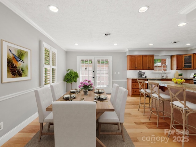 1411 Kensington Rd Unit C-1, Hendersonville, NC 28791 - dining area with crown molding, a textured ceiling, recessed lighting, and light wood-type flooring