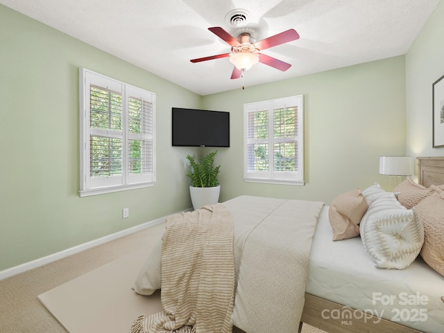 1411 Kensington Rd Unit C-1, Hendersonville, NC 28791 - carpeted bedroom with baseboards and a ceiling fan