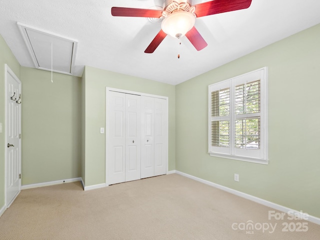 1411 Kensington Rd Unit C-1, Hendersonville, NC 28791 - unfurnished bedroom with attic access, carpet, a closet, and ceiling fan