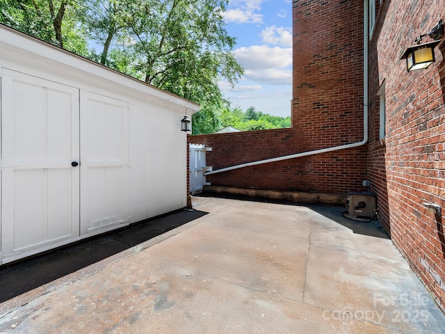 1411 Kensington Rd Unit C-1, Hendersonville, NC 28791 - view of patio featuring a shed