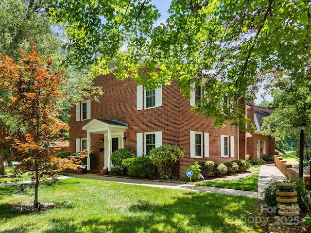1411 Kensington Rd Unit C-1, Hendersonville, NC 28791 - colonial inspired home featuring a front yard and brick siding