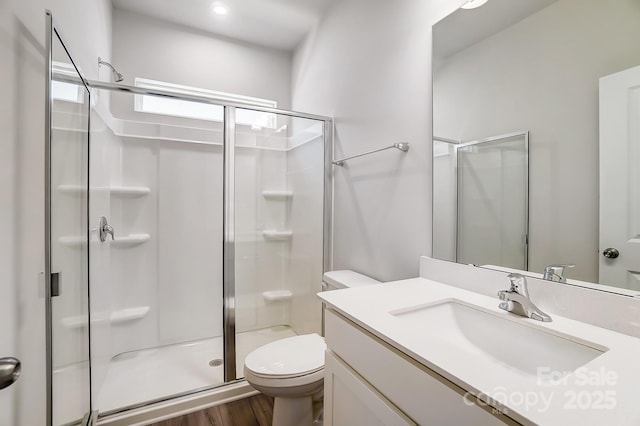 1700 Honey Trl, Monroe, NC 28112 - bathroom featuring a shower stall, vanity, and wood finished floors