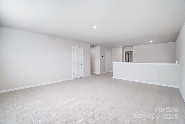 1700 Honey Trl, Monroe, NC 28112 - unfurnished living room with light carpet and recessed lighting