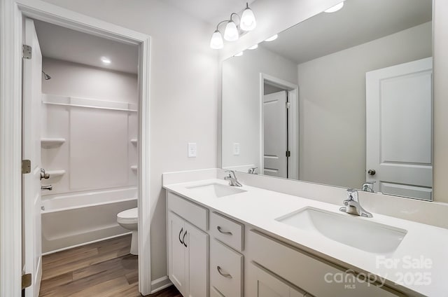 1700 Honey Trl, Monroe, NC 28112 - full bathroom featuring wood finished floors, double vanity, and shower / bath combination