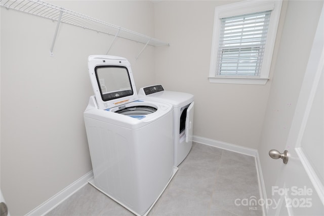 128 Carolina Ash Ln, Mooresville, NC 28117 - washroom with washing machine and clothes dryer and light tile patterned flooring