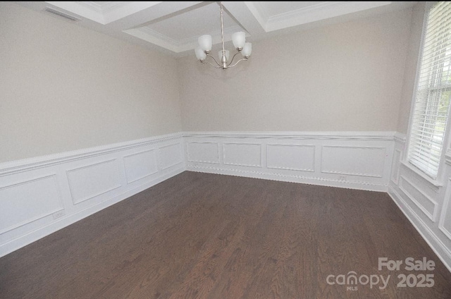128 Carolina Ash Ln, Mooresville, NC 28117 - unfurnished room featuring a chandelier, a decorative wall, ornamental molding, wainscoting, and dark wood-style floors
