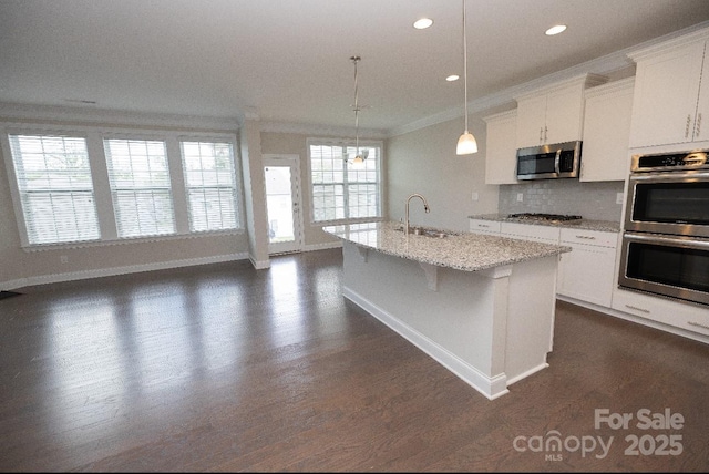 128 Carolina Ash Ln, Mooresville, NC 28117 - kitchen featuring appliances with stainless steel finishes, crown molding, white cabinets, tasteful backsplash, and recessed lighting