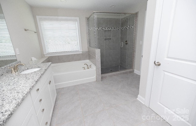 128 Carolina Ash Ln, Mooresville, NC 28117 - full bathroom featuring vanity, a bath, a shower stall, and tile patterned floors