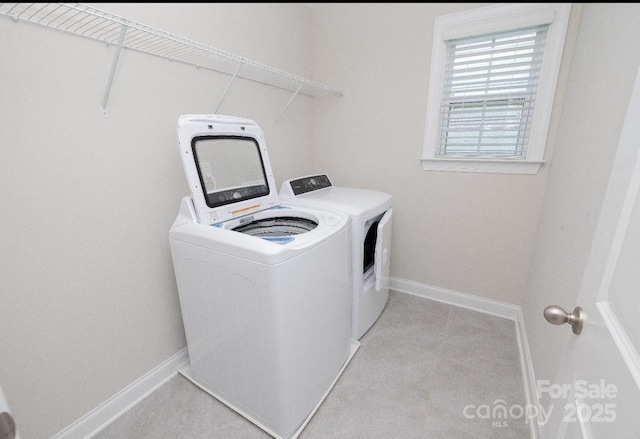 128 Carolina Ash Ln, Mooresville, NC 28117 - laundry room featuring independent washer and dryer and light tile patterned floors