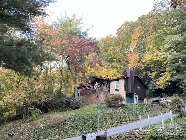 232 Stone Brook Dr, Hendersonville, NC 28791 - view of side of property featuring an attached garage and a chimney