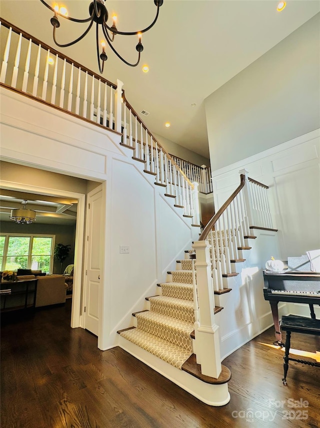 7816 Clovervale Dr, Waxhaw, NC 28173 - staircase with a chandelier, wood finished floors, and recessed lighting