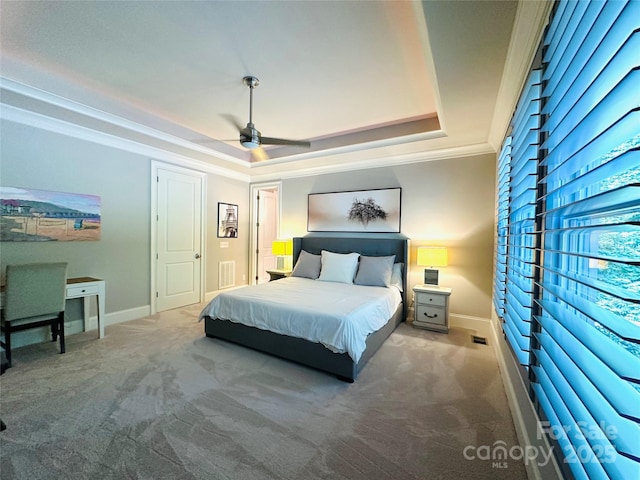 7816 Clovervale Dr, Waxhaw, NC 28173 - carpeted bedroom featuring a tray ceiling, crown molding, and ceiling fan