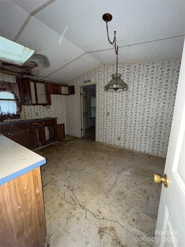 916 Steep Hill Rd, Belmont, NC 28012 - kitchen with vaulted ceiling and decorative light fixtures