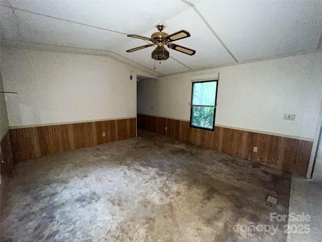 916 Steep Hill Rd, Belmont, NC 28012 - unfurnished room with wainscoting, wooden walls, ceiling fan, carpet flooring, and lofted ceiling