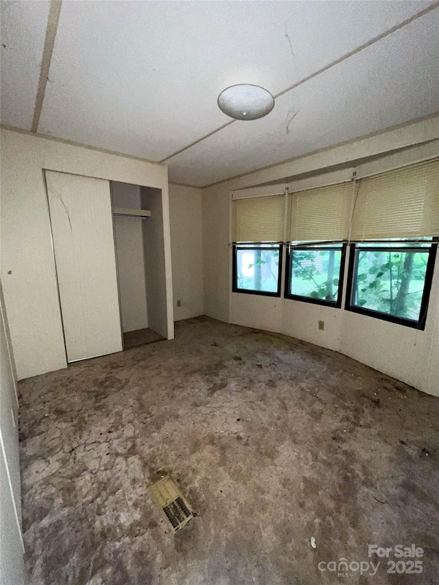 916 Steep Hill Rd, Belmont, NC 28012 - unfurnished bedroom with unfinished concrete flooring and a closet