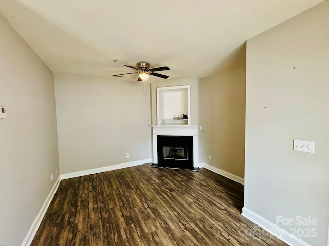 917 Shearer St Unit 15, Davidson, NC 28036 - unfurnished living room with dark wood-type flooring, a ceiling fan, and a fireplace