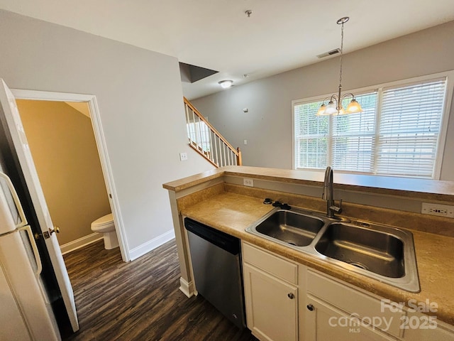 917 Shearer St Unit 15, Davidson, NC 28036 - kitchen featuring stainless steel dishwasher, dark wood finished floors, white cabinetry, a chandelier, and pendant lighting