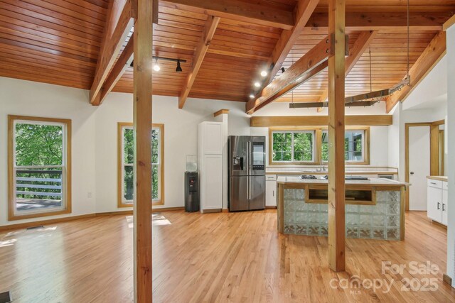295 Dills Rd, Bryson City, NC 28713 - kitchen featuring stainless steel fridge, wooden ceiling, white cabinets, plenty of natural light, and light wood-style floors