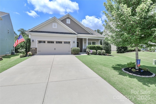 201 Fesperman Cir, Troutman, NC 28166 - craftsman inspired home featuring a garage, a front yard, concrete driveway, and covered porch