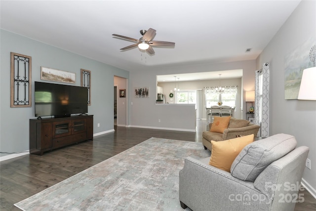 201 Fesperman Cir, Troutman, NC 28166 - living room with a ceiling fan, dark wood-type flooring, and a chandelier