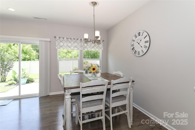 201 Fesperman Cir, Troutman, NC 28166 - dining area featuring a chandelier and dark wood-style floors