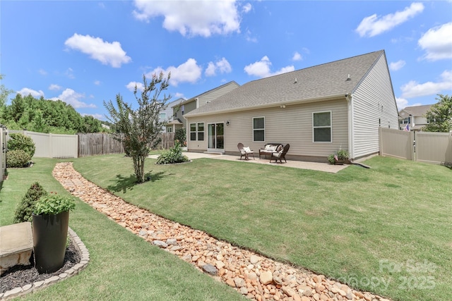 201 Fesperman Cir, Troutman, NC 28166 - back of property with a patio, a fenced backyard, a gate, and a shingled roof