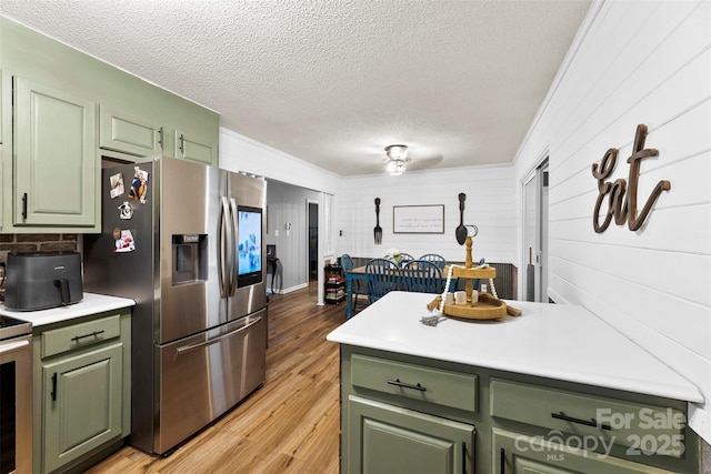 339 Deep Forest Ct, Gastonia, NC 28056 - kitchen with green cabinets, stainless steel fridge, a textured ceiling, light countertops, and light wood-type flooring