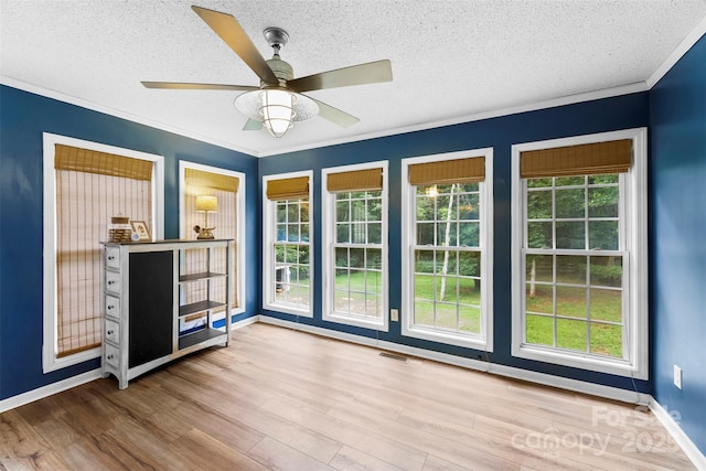339 Deep Forest Ct, Gastonia, NC 28056 - unfurnished living room with ornamental molding, a textured ceiling, wood finished floors, and ceiling fan