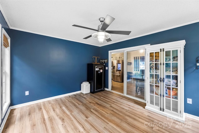 339 Deep Forest Ct, Gastonia, NC 28056 - unfurnished room with wood finished floors, a ceiling fan, and crown molding