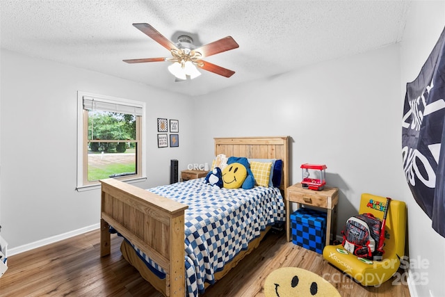 339 Deep Forest Ct, Gastonia, NC 28056 - bedroom with wood finished floors, a textured ceiling, and ceiling fan