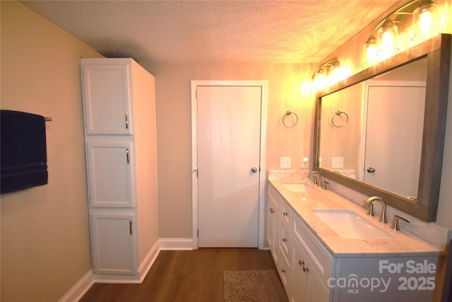 6264 Burnhurst Ln, Denver, NC 28037 - bathroom featuring a textured ceiling, wood finished floors, and double vanity