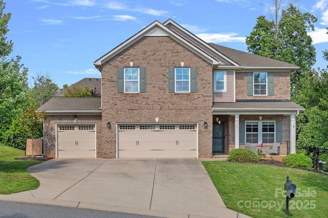 161 Oxford Dr, Mooresville, NC 28115 - view of front of property featuring concrete driveway, a front yard, brick siding, and an attached garage