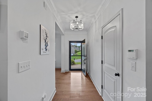 161 Oxford Dr, Mooresville, NC 28115 - corridor with a chandelier, ornamental molding, and dark wood finished floors
