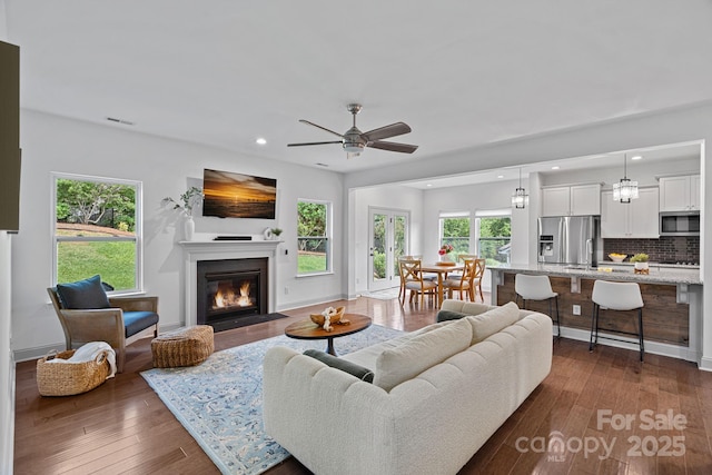 161 Oxford Dr, Mooresville, NC 28115 - living room with ceiling fan, recessed lighting, a fireplace with flush hearth, and dark wood-style floors
