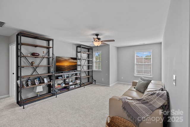 161 Oxford Dr, Mooresville, NC 28115 - carpeted living area with a ceiling fan and baseboards