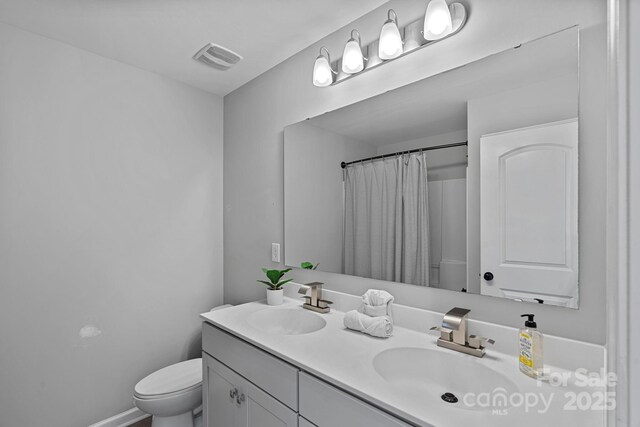 161 Oxford Dr, Mooresville, NC 28115 - bathroom with double vanity and a shower with curtain