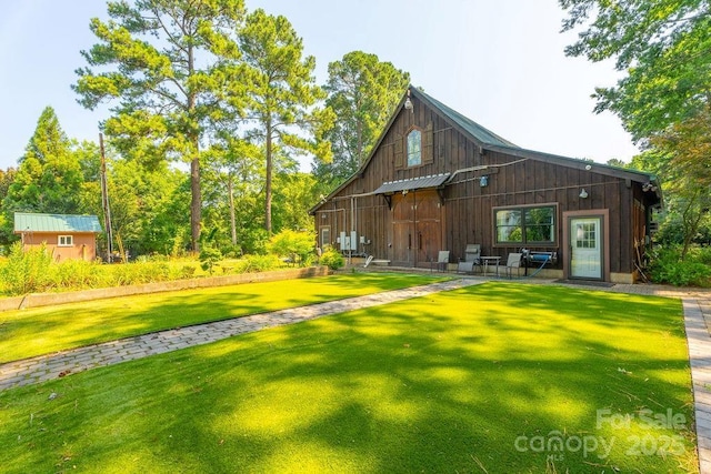 9032 Boyd Dr, Matthews, NC 28105 - rear view of property featuring a lawn and an outbuilding